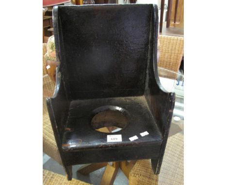 Miniature rustic stained commode armchair.