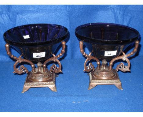 Two amethyst bowls raised on scroll copper tripod stands.  (2) 