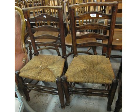 Pair of stained ladder back chairs with rush seats. (2)
