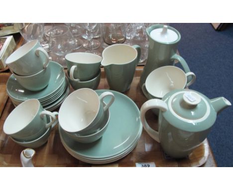 Tray of Poole pottery tea ware items on a green and cream ground comprising tea cups and saucers, teapot, plates etc. 