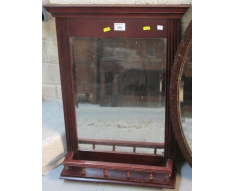 20th Century stained, bevel plate wall mirror with under shelf.