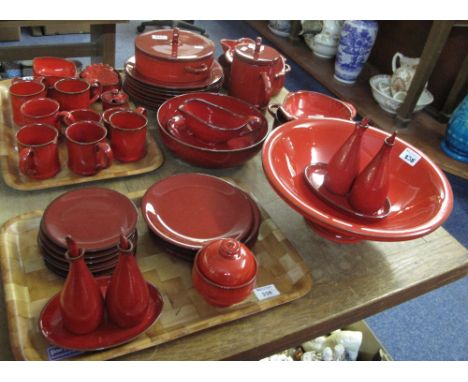 Collection of red glazed ceramic dinnerware.  Some marked: Villeroy and Boch; Grenada dinnerware items comprising: coffee mug