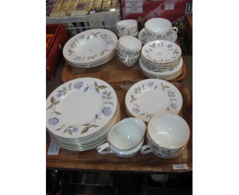 Two trays of Royal Worcester fine bone china 'Blue Poppy' items comprising tea cups and saucers, various plates, milk jug and