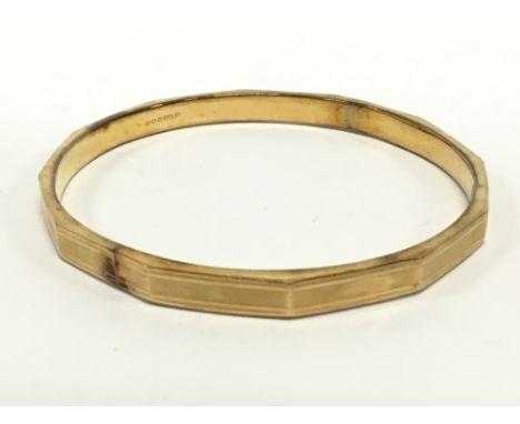 A large 9 carat gold bangle.(10.5g)