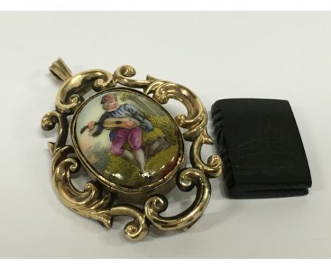 A Victorian yellow metal brooch with later conversion to pendant with 9 carat gold bale with ceramic painted panel together w