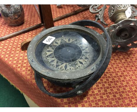 An early 20th century brass and metal cased ships compass.