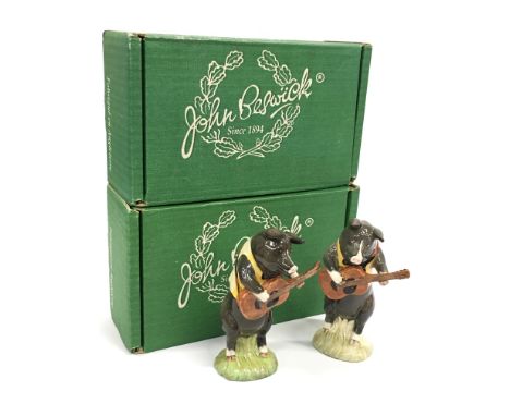 A Beswick china model of a pig playing guitar: Christopher together with another matching figure (both with original boxes).