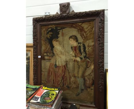 A 19th century carved oak framed tapestry: Courting couple.
