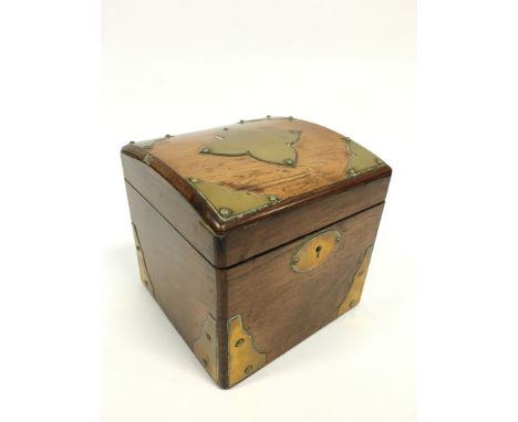 A 19th century brass bound fruitwood square caddy with lidded interior.