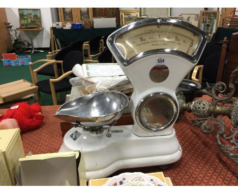 A Mattocks white enamel Grocer's weighing scales.
