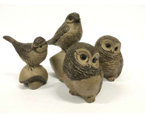 A pair of Poole Pottery Barbara Linley Adams stoneware models of chicks together with two birds.