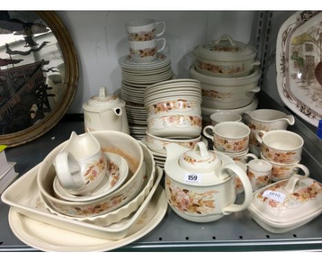 The residue of an extensive Poole Pottery dinner and breakfast service, decorated in the Summer Glory pattern.
