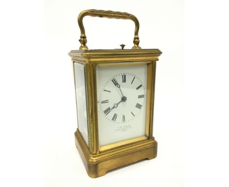 A brass and glass cased repeating carriage clock by J. W. Benson, Old Bond Street, London (12.5cm).