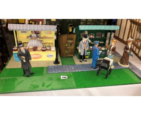 SCALE MODEL OF THE CAKE STALL AND CONFECTIONERY MARKET STALL, WITH OTHER FIGURES