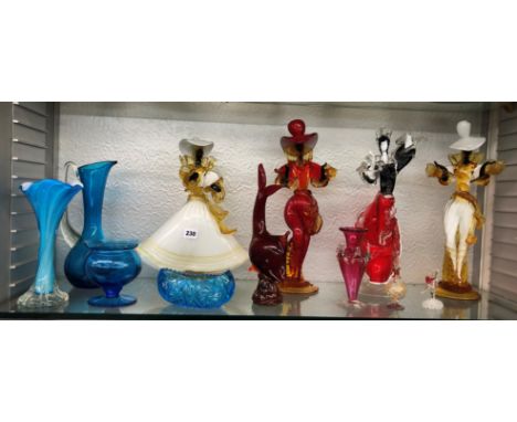 SHELF OF MURANO GLASS DANCING FIGURES, CRANBERRY GLASS SPILL VASE AND BLUE GLASSWARE A/F