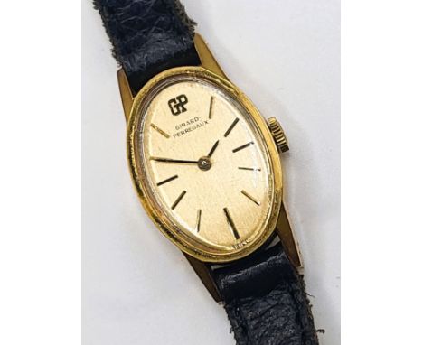 A Girard Perregaux gold plate ladies watch with original purchase receipt (1979) and original presentation box.