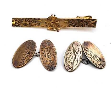 A 9ct yellow gold and silver oval cufflinks engraved JP and with a chain link 5.8gms, and a Chinese dragon machine cut tie pi