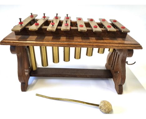 A mid-century brass xylophone