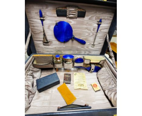 A Finnigan's of Bond Street travel/ vanity case with lapis blue enamel and copper accessories with original travel labels fro