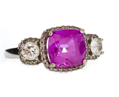 PINK GEM AND DIAMOND RING, set with a central cushion shaped pink gem flanked by two round brilliant cut diamonds approximate