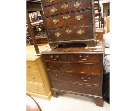 A late George III mahogany chest, the top cross-banded and satinwood strung with applied moulded edge over two short and thre