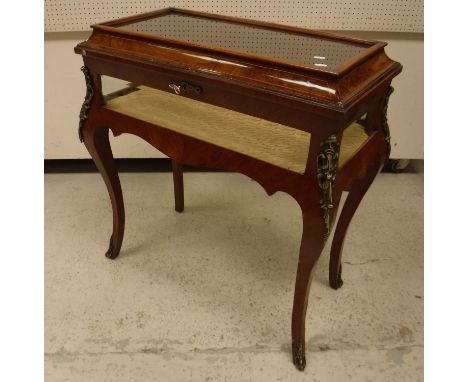 A modern kingwood bijouterie cabinet in the Louis XV taste with glass panelled caddy top over glass panelled sides, raised on