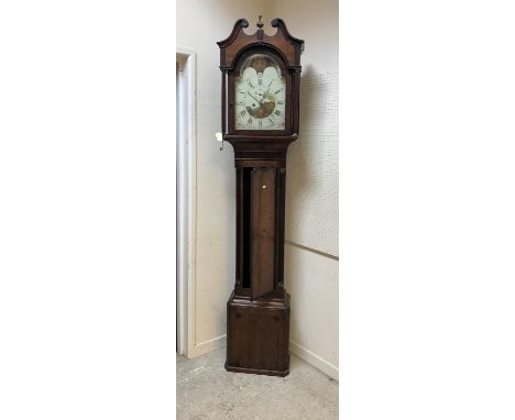 An 18th Century oak cased long case clock, the eight day movement with enamelled and painted arch dial, sun and moon phase, a