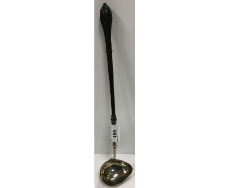 A George II silver punch ladle with shallow lip and turned wooden handle (by John Gamon, London 1733) CONDITION REPORTS Condi