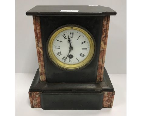 A late 19th Century French black marble and rosso marble cased mantel clock, the thirty hour movement with circular enamelled