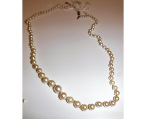 A pearl single strand necklace with white metal diamond encrusted barrel shaped clasp, 48 cm long CONDITION REPORTS Please se