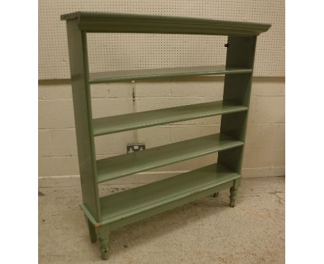 A rush seated beech framed bar chair, a blue canvas covered strapwork trunk, a painted open bookcase, two rustic walking stic