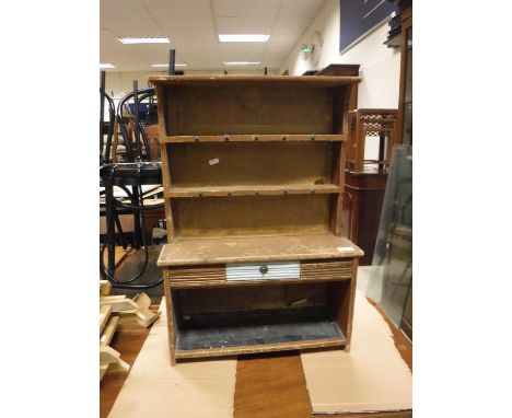 A child's stained and painted pine dresser with two tier boarded plate rack over a single drawer and pot shelf 48 cm wide x 1