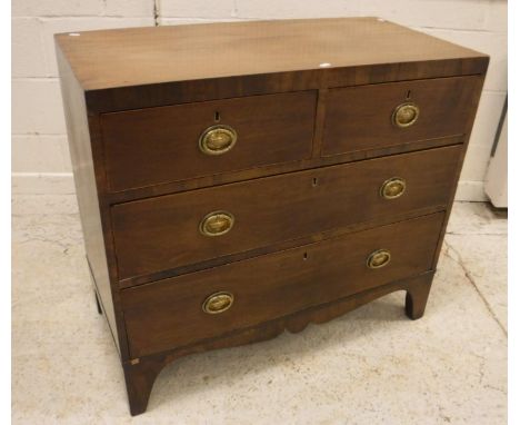 An early 19th Century mahogany square front chest, the plain top above two short and two long drawers, each satinwood strung 