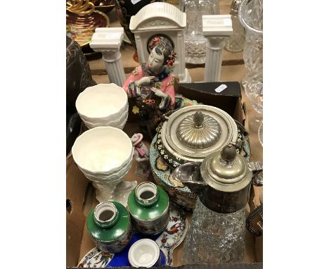 A collection of various china wares to include a Beleek mantel clock with clover decoration and German movement, a pair of Du