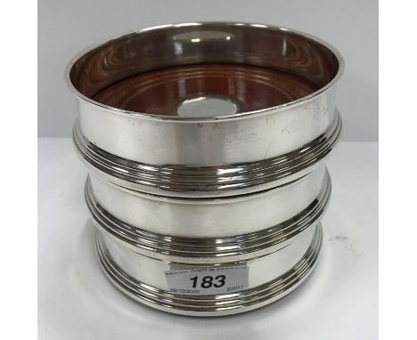 A set of three modern silver bottle holders of plain form (by W I Broadway &amp; Co., Birmingham) CONDITION REPORTS Basically