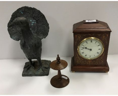A mahogany and marquetry inlaid cased mantel clock with circular enamelled dial 20 cm high, an embossed brass jardiniere with