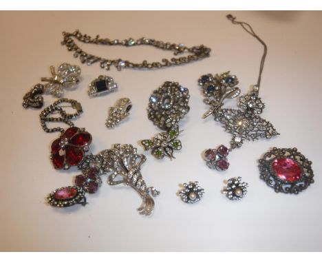 A collection of diamante style and other faux diamond encrusted jewellery including various brooches, pendant, butterfly broo
