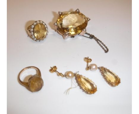 A collection of citrine jewellery including 9 carat gold mounted and seed pearl decorated oval brooch, 3.3 cm x 2.7cm, a 9 ca