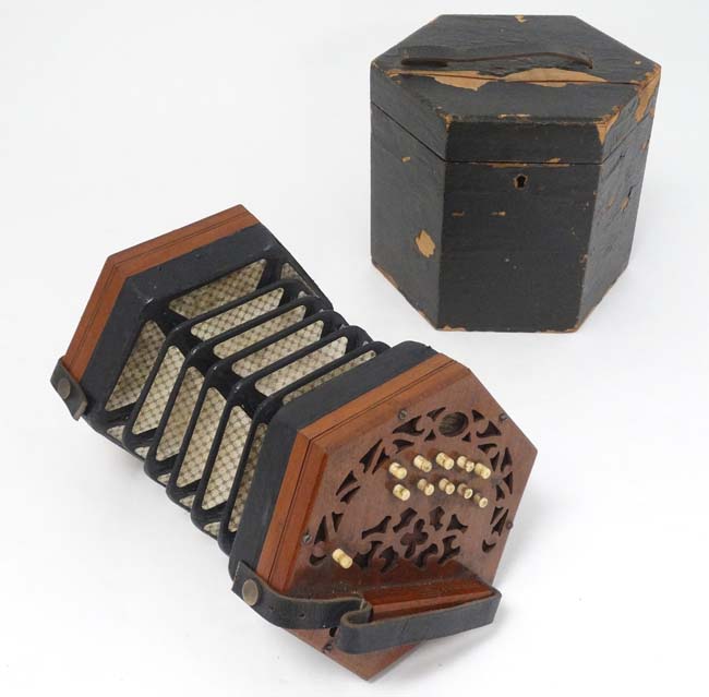 Musical Instruments A late 19th early 20thC cased Squeezebox