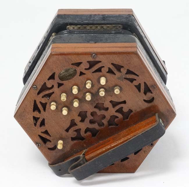 Musical Instruments A late 19th early 20thC cased Squeezebox