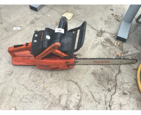 A MAKITA PETROL CHAIN SAW IN GOOD WORKING ORDER 