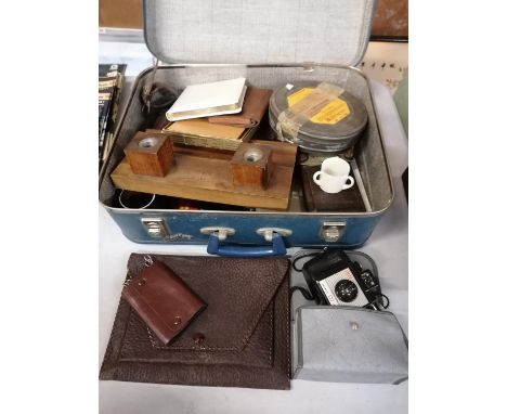 A VINTAGE SUITCASE AND CONTENTS 