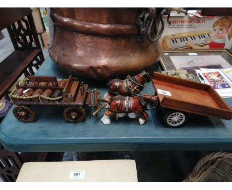 TWO CERAMIC SHIRE HORSE MODELS AND CART TOGETHER WITH FURTHER HAND CART 