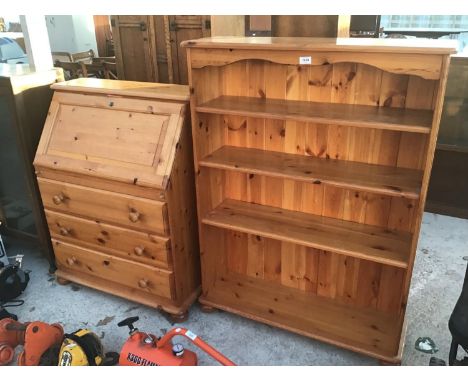 TWO PINE ITEMS TO INCLUDE A FALL FRONT DESK WITH THREE LOWER DRAWERS AND A FOUR SHELF BOOK CASE 