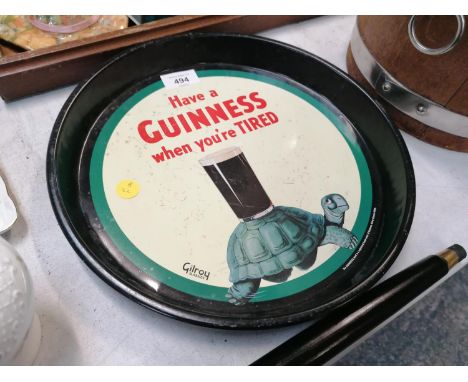 A GUINNESS VINTAGE STYLE ROUND TIN TRAY 