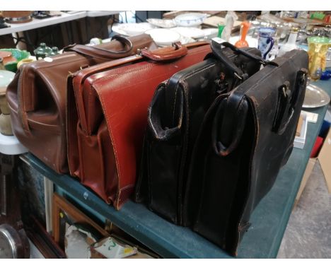 FOUR VINTAGE LEATHER BRIEFCASES 
