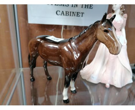 A BESWICK BROWN GLOSS CERAMIC HORSE MODEL 