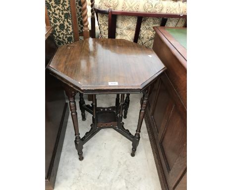 AN OCTAGONAL MAHOGANY OCCASIONAL TABLE WITH GALLERIED LOWER SHELF 