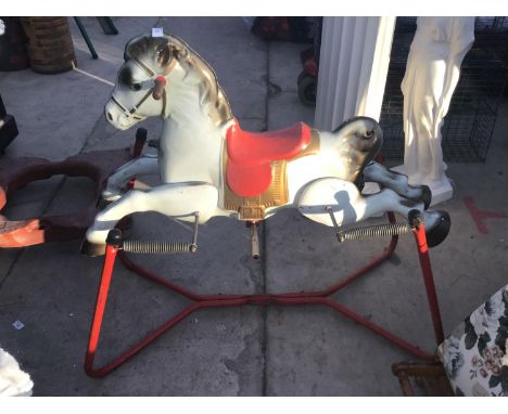 A VINTAGE METAL ROCKING HORSE ON SPRINGS 