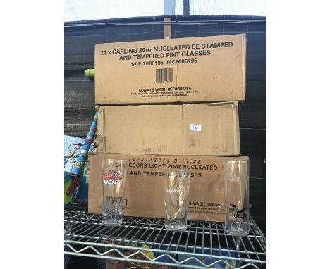 A LARGE COLLECTION OF GLASSES TO INCLUDE COORS LIGHT, GUINNESS AND CARLING 